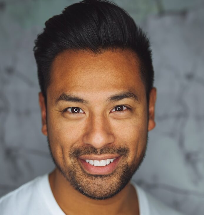 man wearing white V-neck shirt